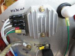 John Deere regulator. Pins from top to bottom are: 1=Regulated +12V output; 2,3=Dynamo input; 4=Idiot light; 5=+12V Power for regulator IMG_0701.jpg